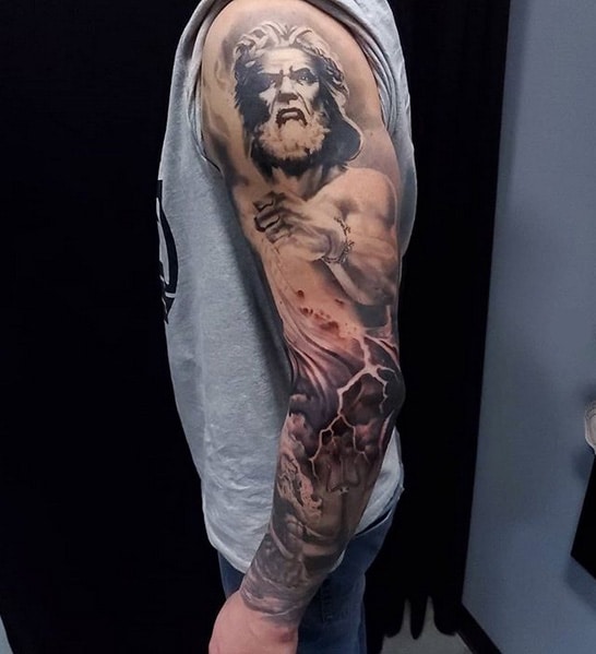 Full sleeve Zeus, lightning, ocean, and boat tattoo. 